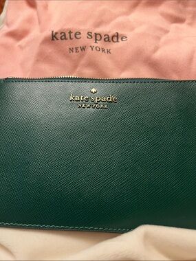 Kate Spade Staci Medium Slim Wristlet with gold accents.  NEW with dust bag.